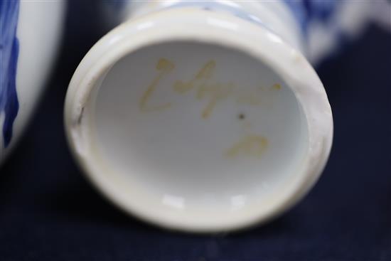 A Chinese blue and white small jar and cover, and a similar small vase, Kangxi period, H. 6.7 and 7.7cm
